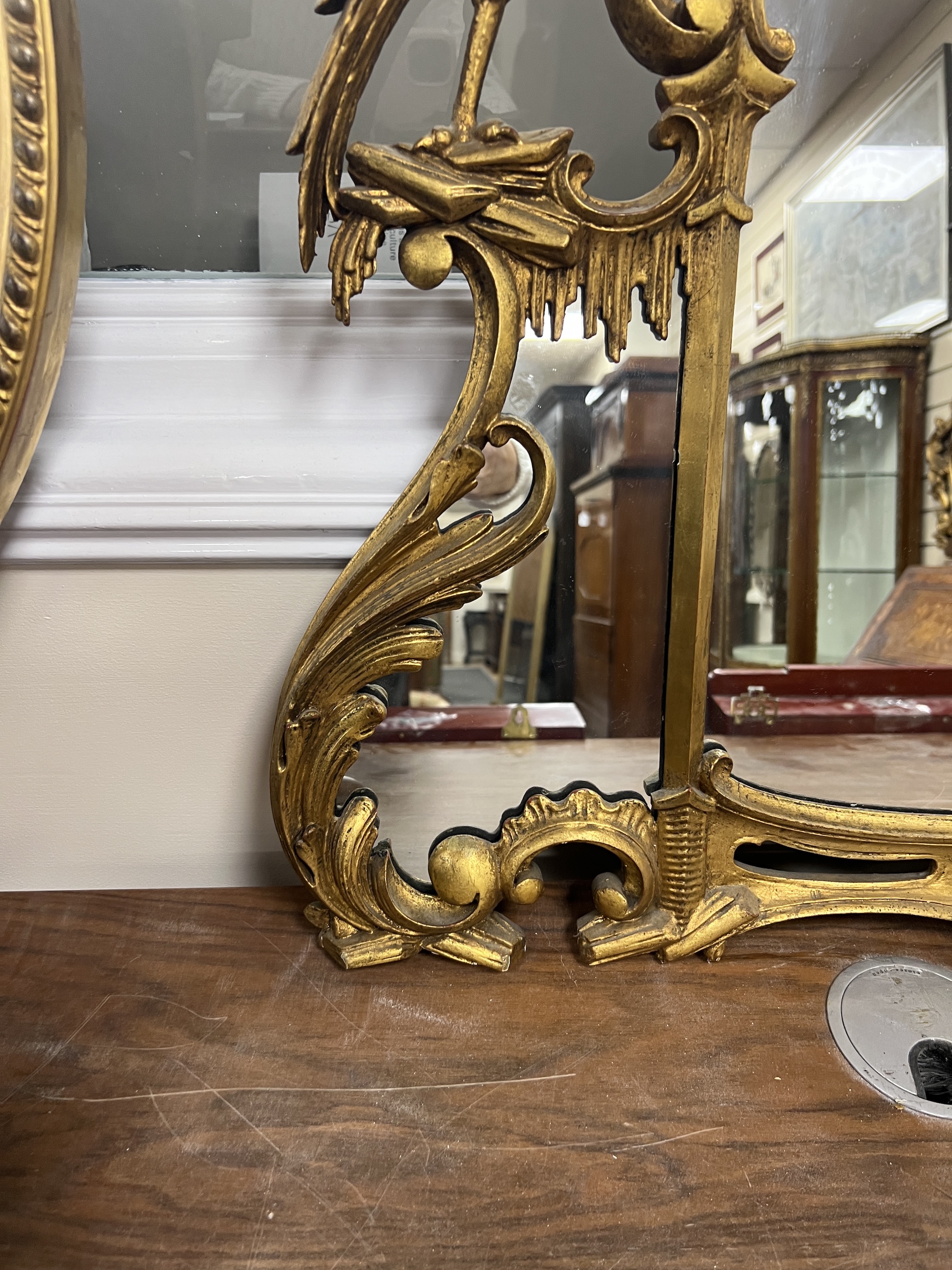 An 18th century style carved giltwood and composition wall mirror, width 122cm, height 80cm